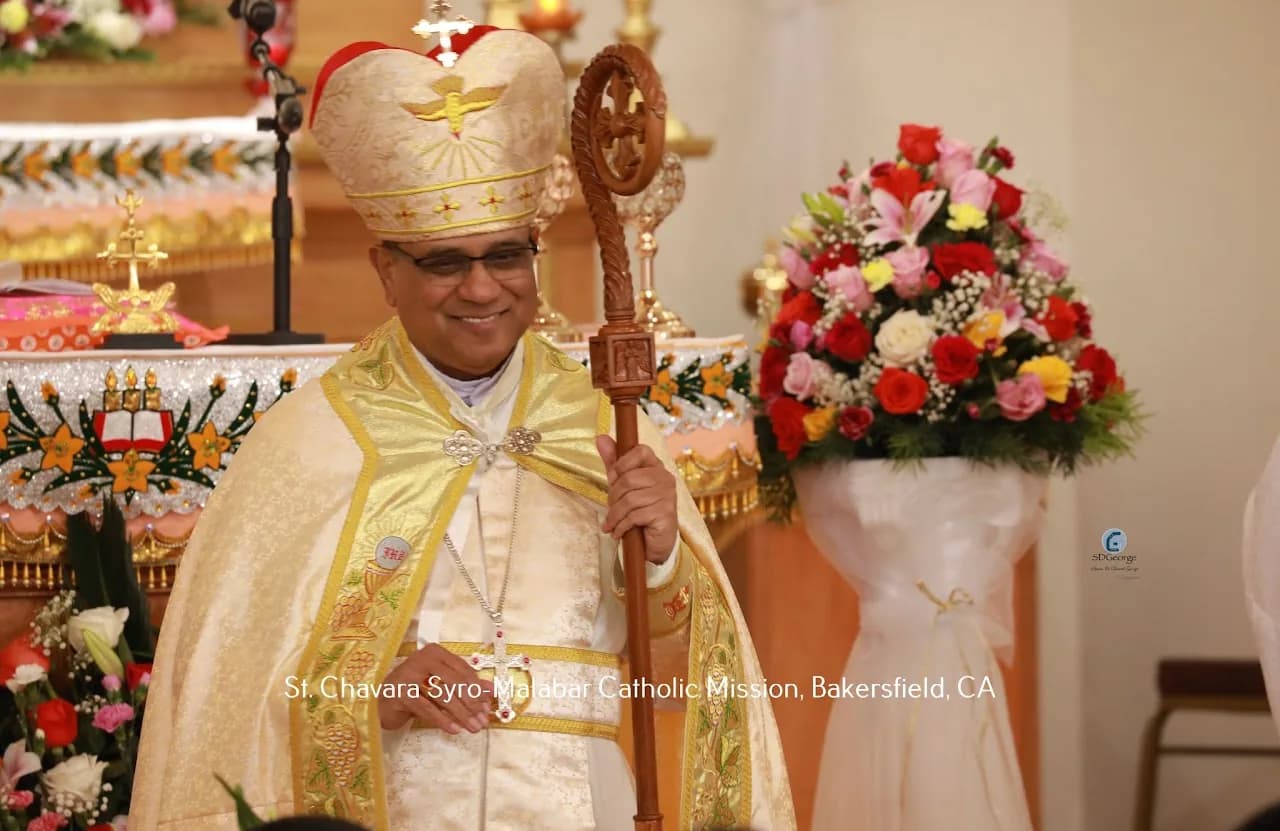Smiling bishop in gold mitre and cope holding a carved wooden crozier beside the altar