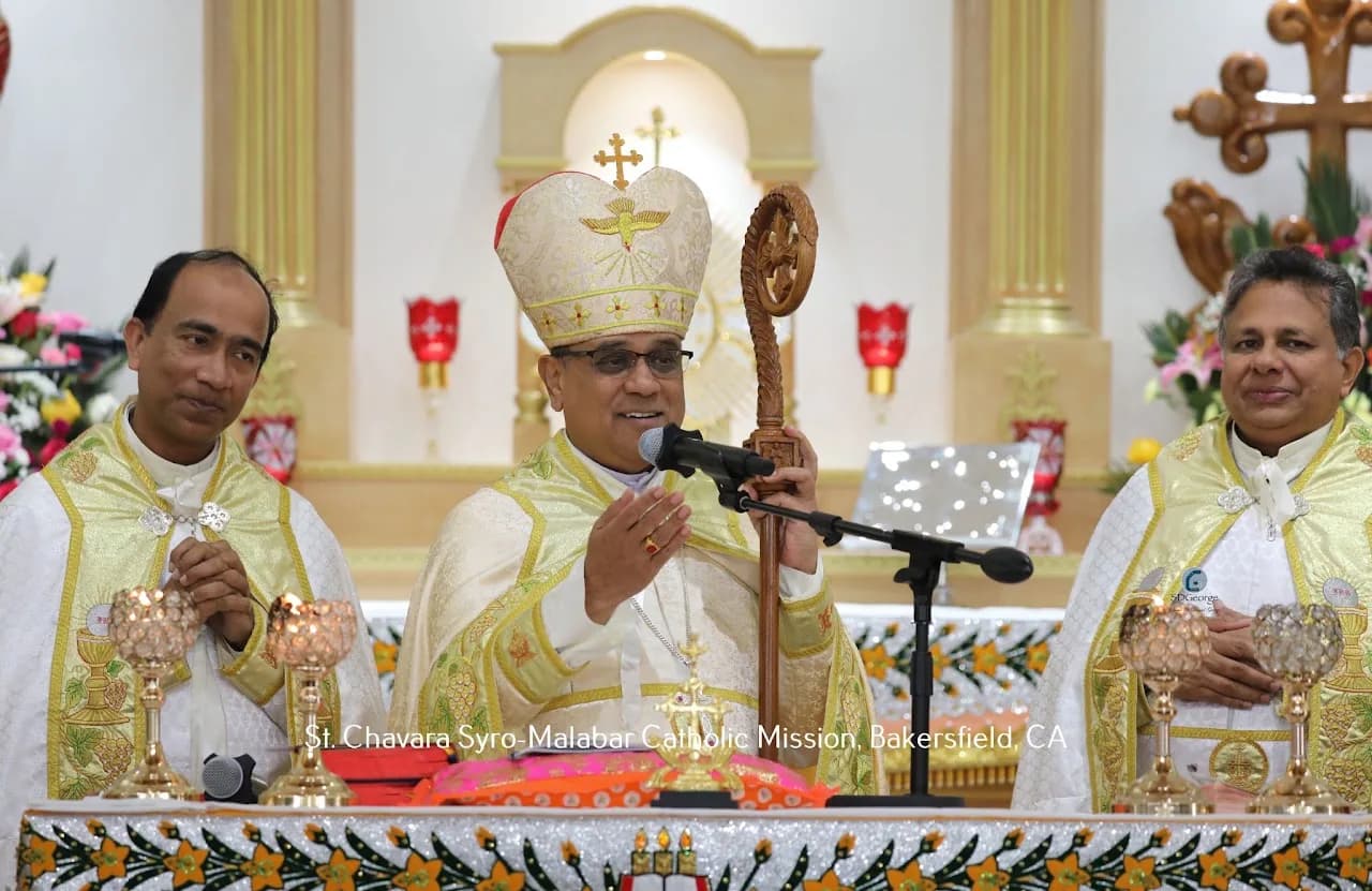 Bishop with mitre and carved crozier speaking at the altar between two vested priests